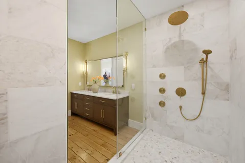 a bathroom with a sink and mirror