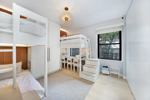 a living room with furniture a dining table and a large window