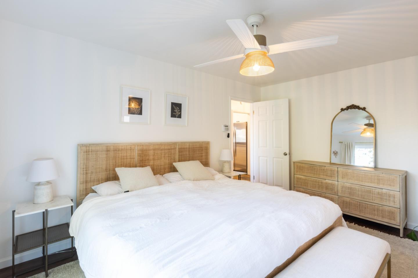 Channel Drive Santa Rosa, CA 95409 - Photo 13 of 29 a bedroom with a large bed and a chandelier