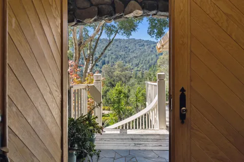 a view of balcony with wooden floor