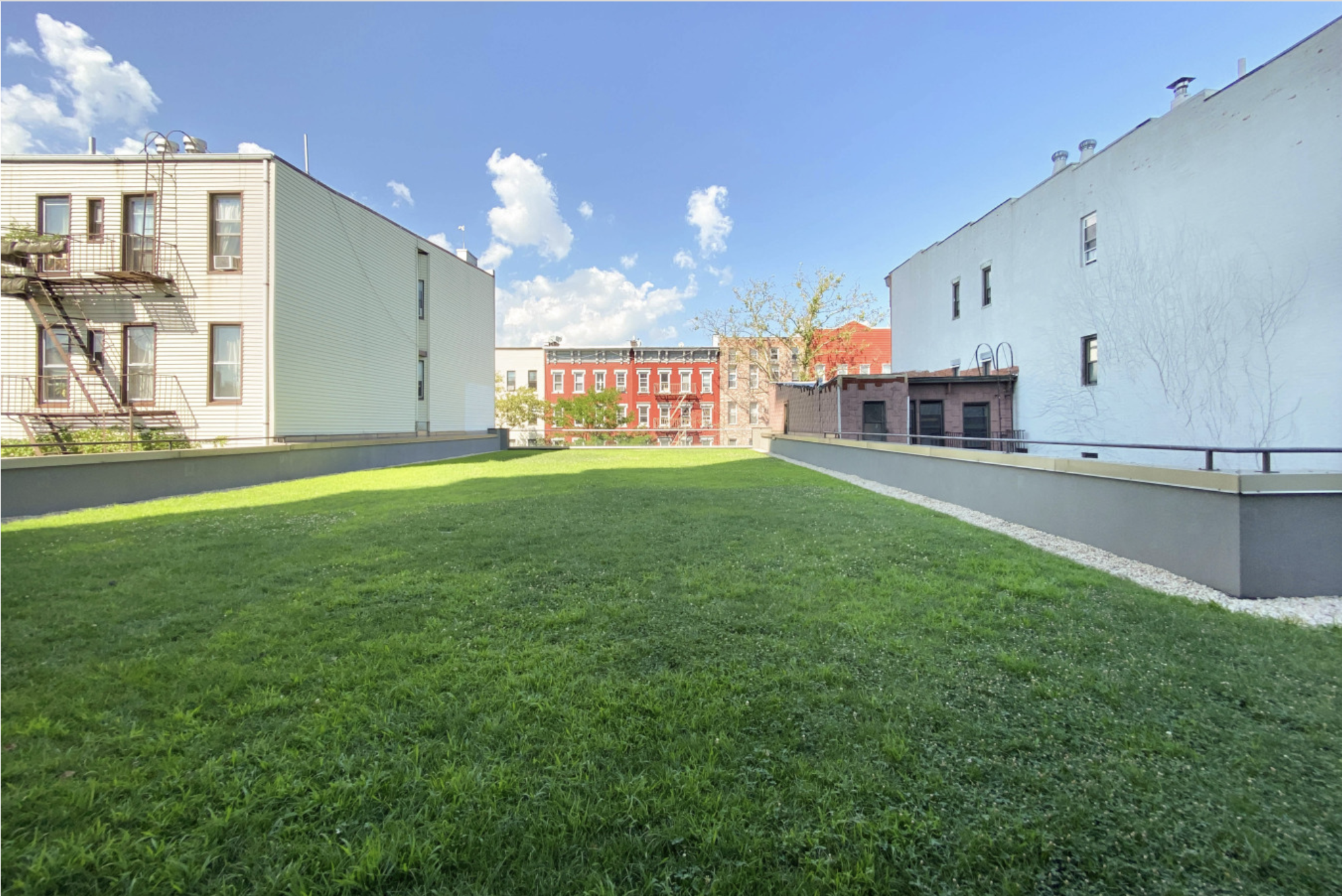 144 North 8th Street, Unit 8C Brooklyn, NY 11249 - Photo 11 of 13 a view of a street with seating area and car parked