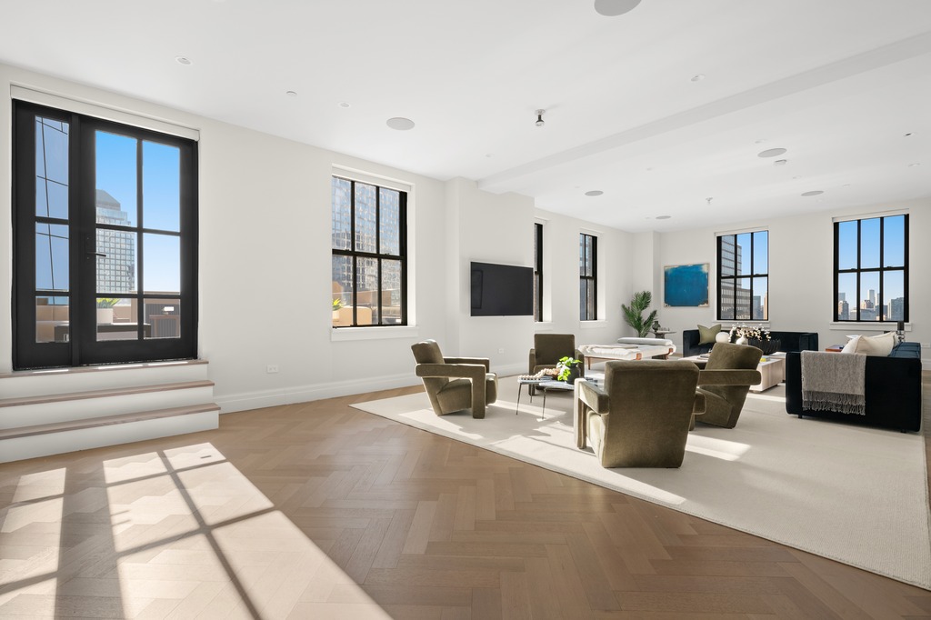 100 Barclay Street, Unit 21AD Manhattan, NY 10007 - Photo 2 of 40 a living room with furniture a flat screen tv and a window