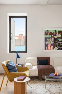 a living room with furniture and a window