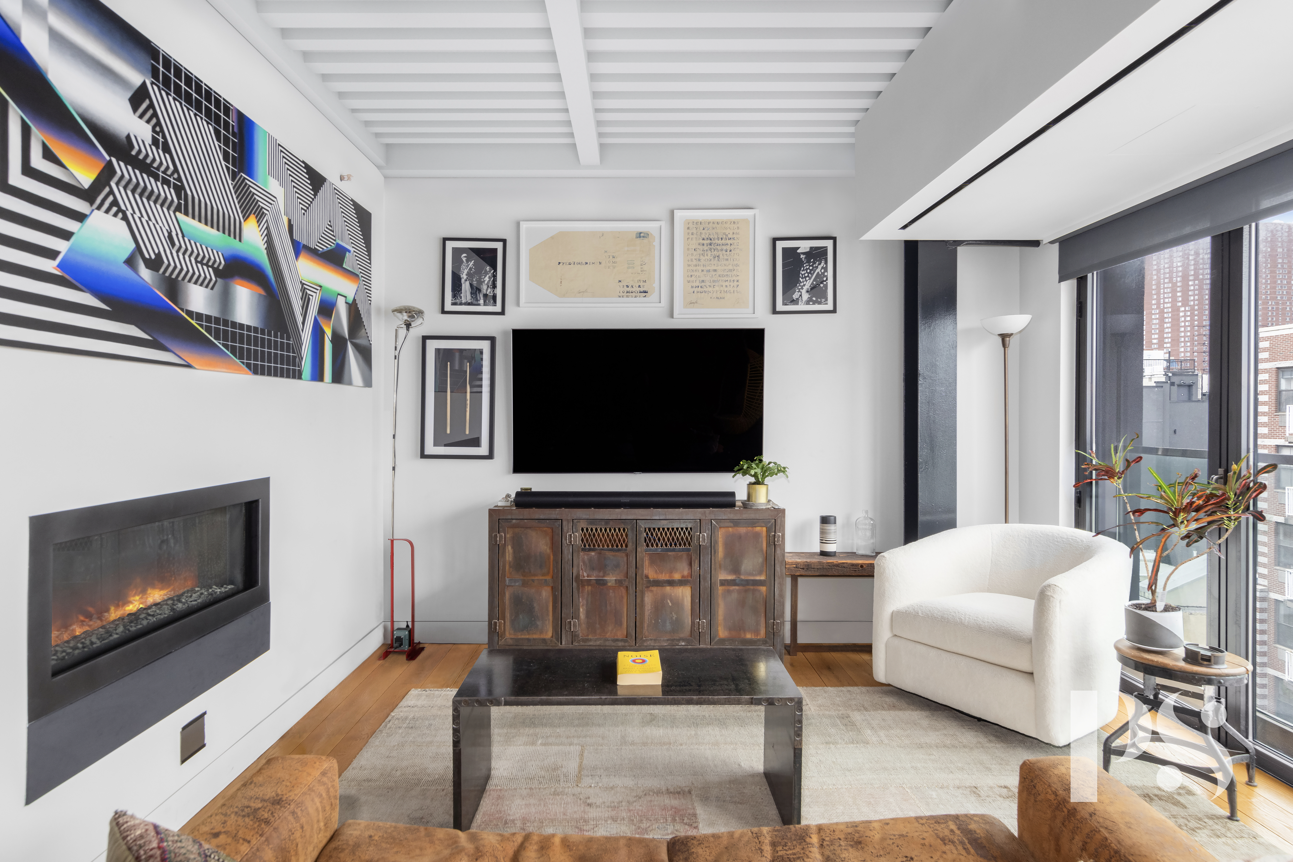 60 Orchard Street, Unit PH Manhattan, NY 10002 - Photo 5 of 19 a living room with furniture and a flat screen tv