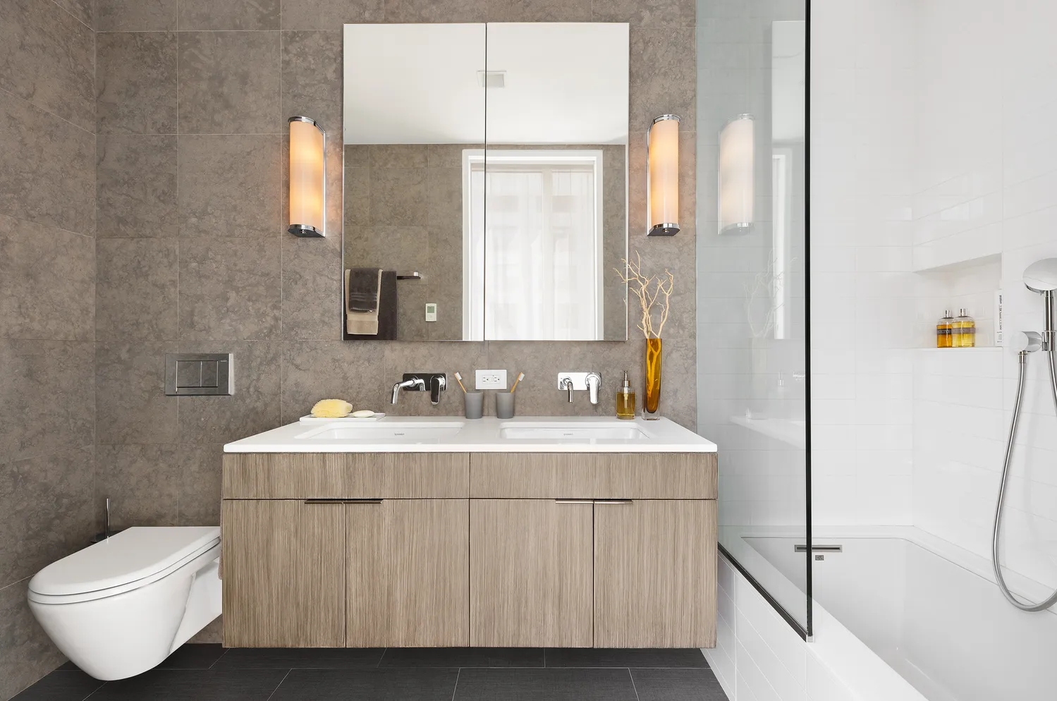 a bathroom with a sink toilet and mirror