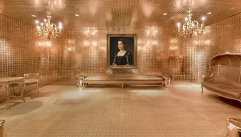 a view of a lobby with furniture and a chandelier