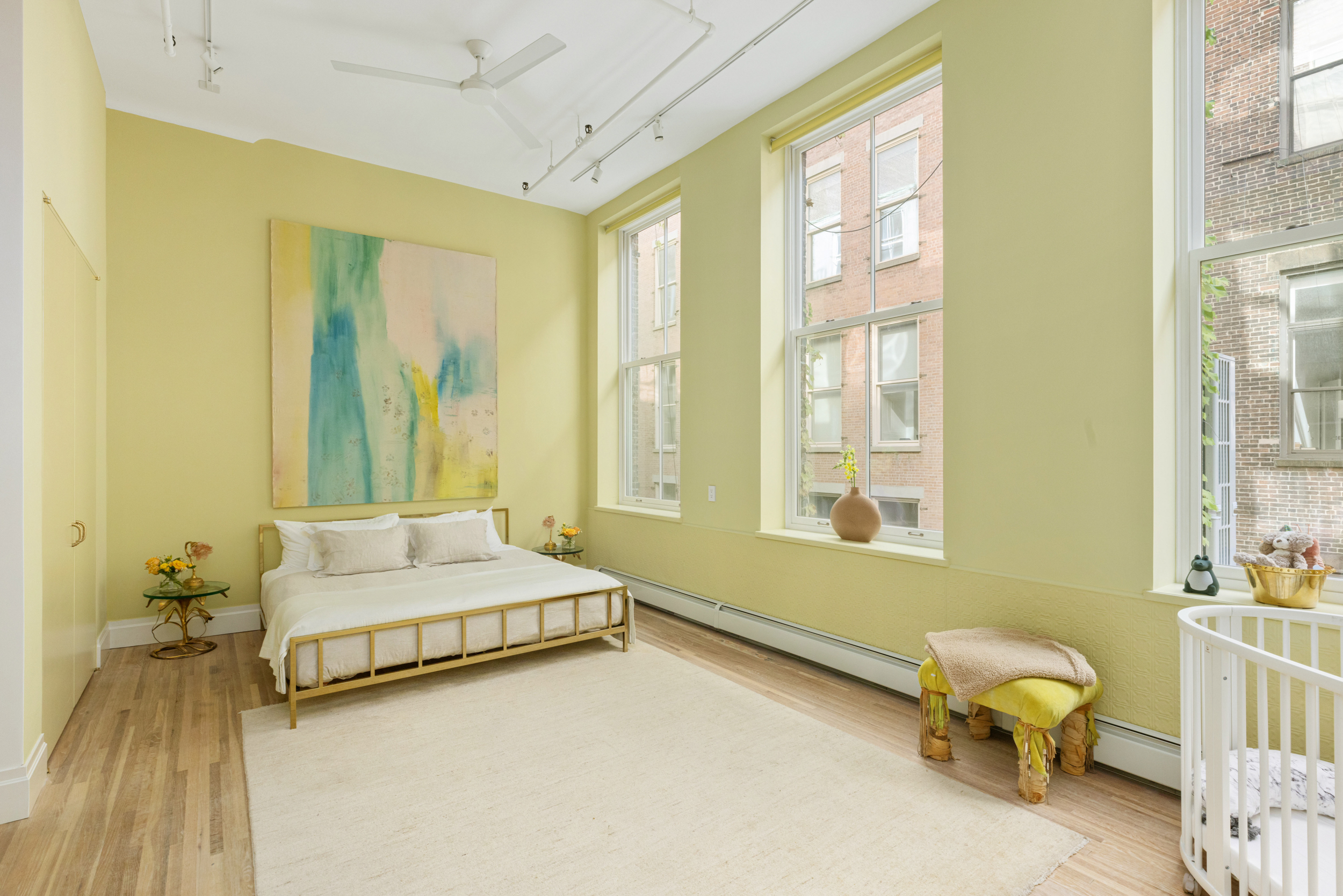 55 Walker Street, Unit 3A Manhattan, NY 10013 - Photo 7 of 12 a spacious bedroom with a bed and wooden floor