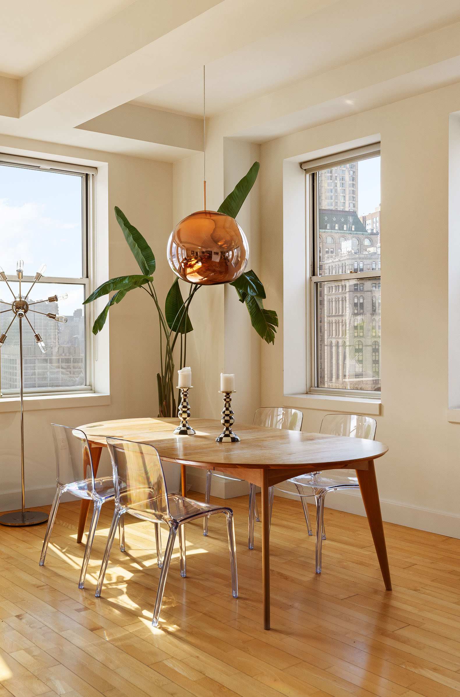 80 Chambers Street, Unit 11A Manhattan, NY 10007 - Photo 5 of 24 a view of a dining room with furniture window and wooden floor