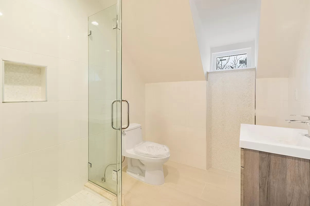 4015 Atlantic Avenue Brooklyn, NY 11224 - Photo 8 of 14 a bathroom with a toilet sink and shower