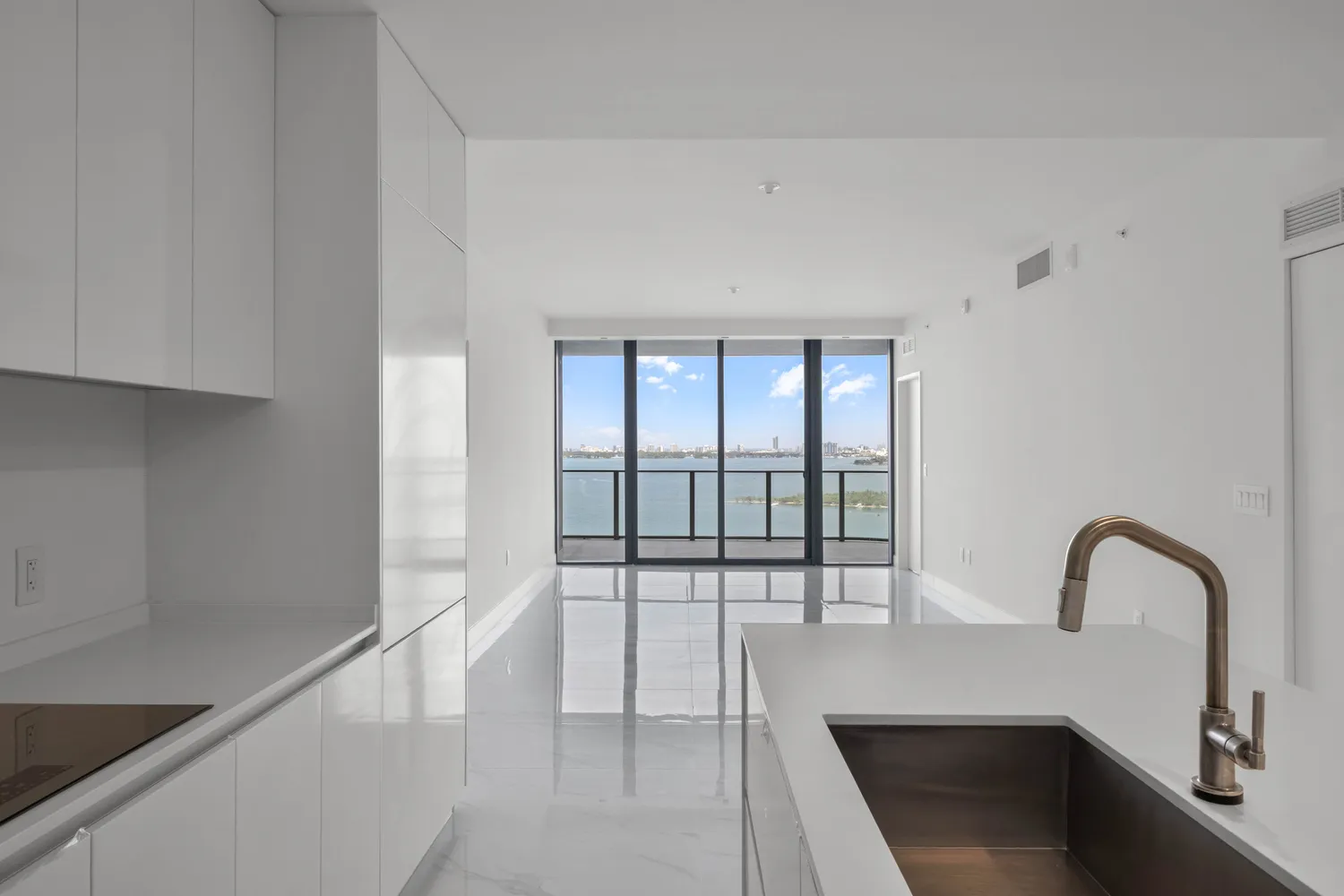 a view of a bathroom with a sink and a large window