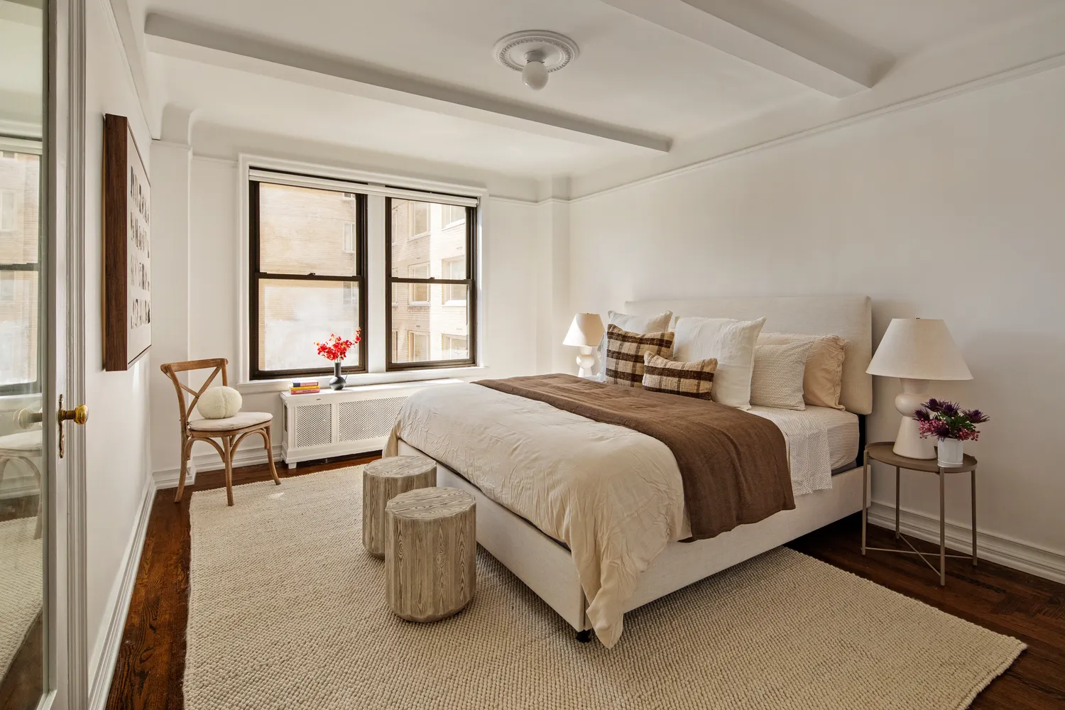 a bed room with a bed and a chair