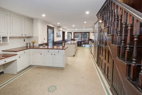 a kitchen with cabinets and window