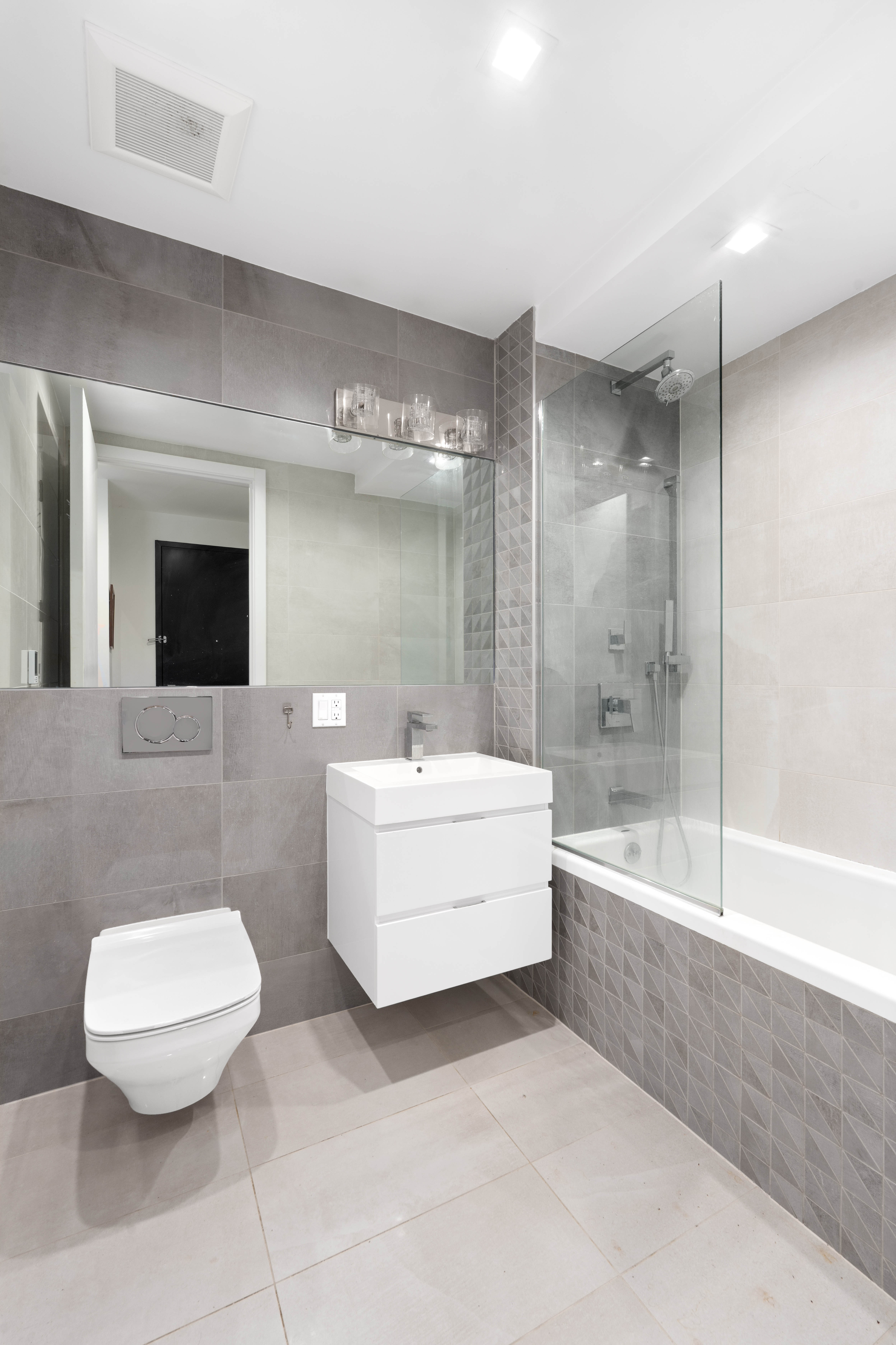 676 Halsey Street, Unit 1B Brooklyn, NY 11233 - Photo 8 of 9 a bathroom with a sink a toilet and bathtub