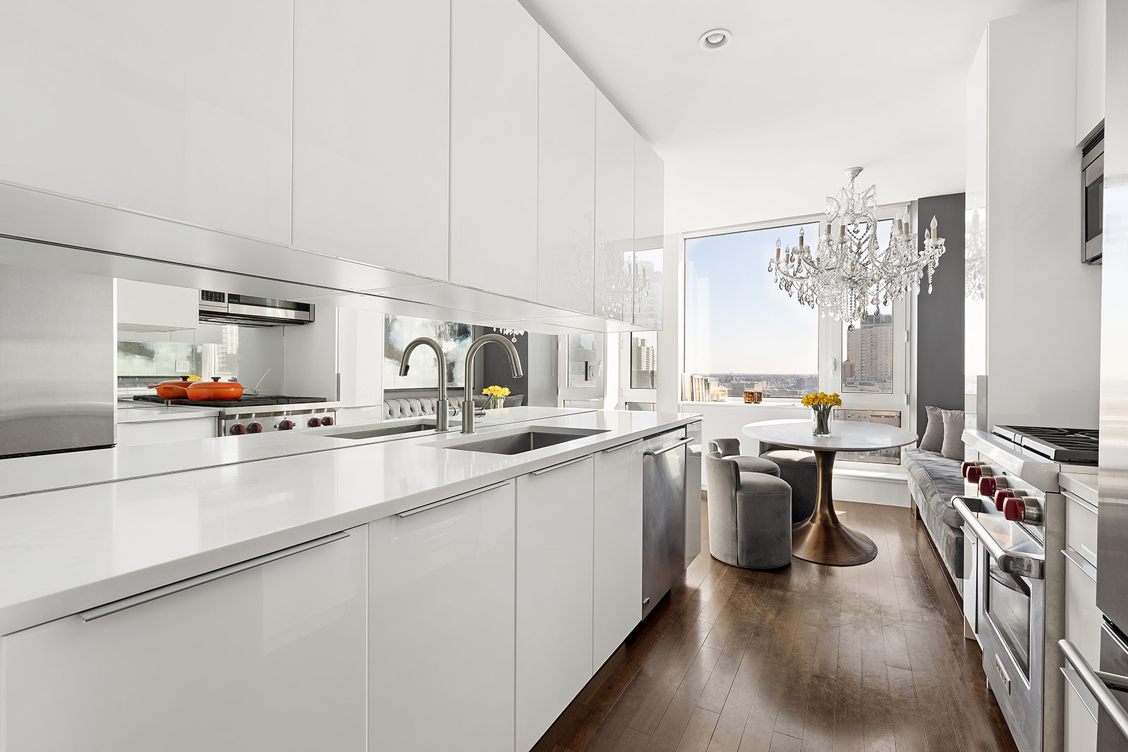 300 East 77th Street, Unit 18C Manhattan, NY 10075 - Photo 3 of 12 a kitchen with lots of counter top space and wooden floor