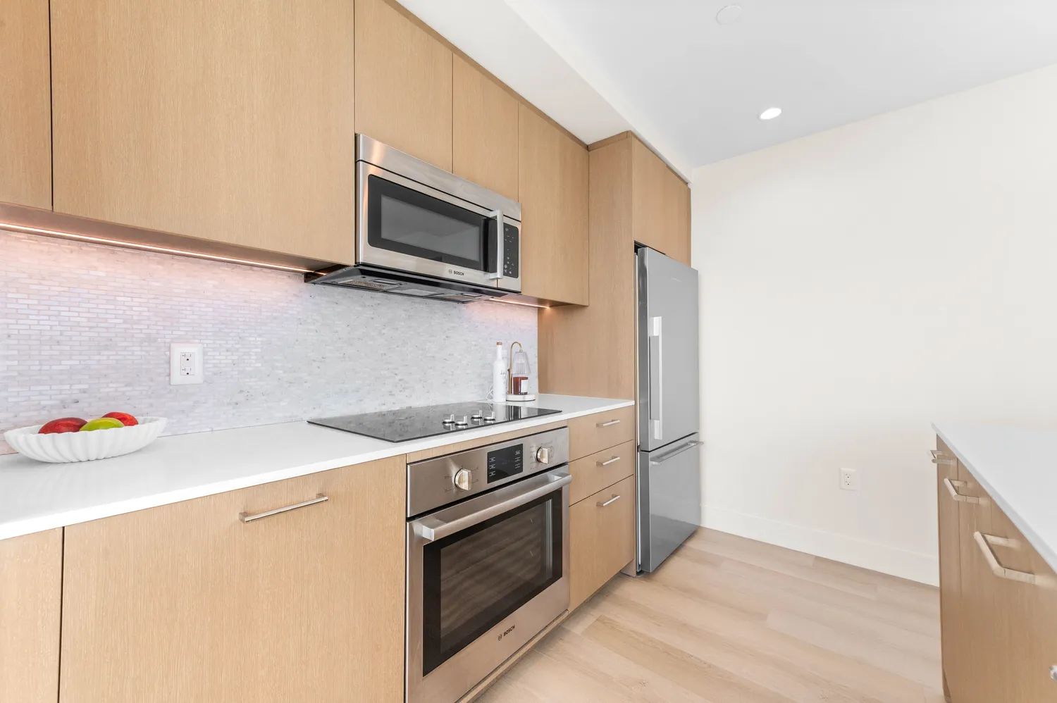 a kitchen with a stove and a microwave