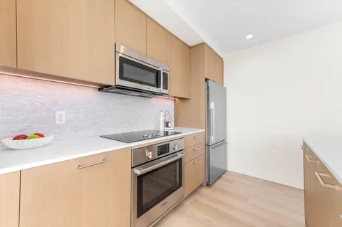 a kitchen with a stove and a microwave