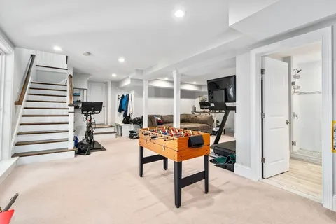 a living room with furniture gym equipment and a view of living room
