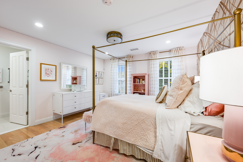45 Washburn Avenue Needham, MA 02492 - Photo 12 of 23 a bedroom with a bed and a large mirror on the dresser
