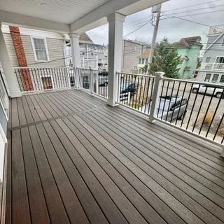 a view of swimming pool with outdoor seating and yard in back