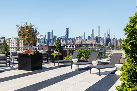 a view of a terrace with sitting chairs