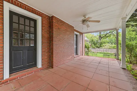 a kitchen with stainless steel appliances granite countertop a stove top oven a sink dishwasher and white cabinets with wooden floor