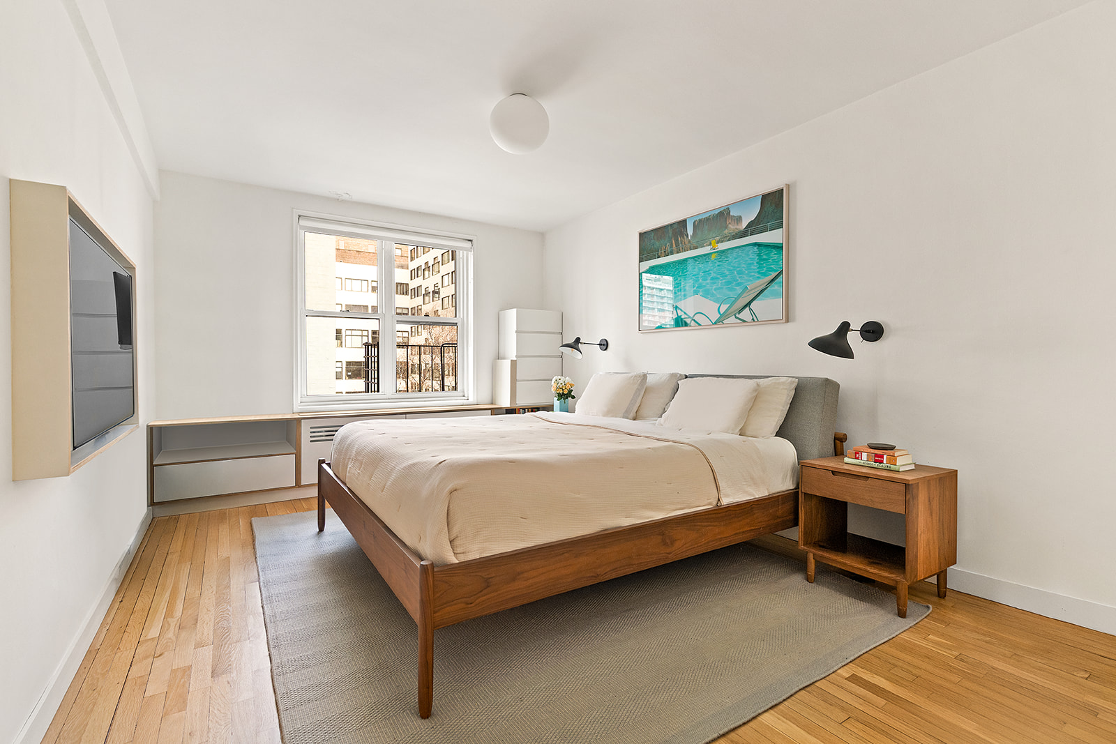 88 Bleecker Street, Unit 5G Manhattan, NY 10012 - Photo 4 of 9 a bedroom with a bed and a window