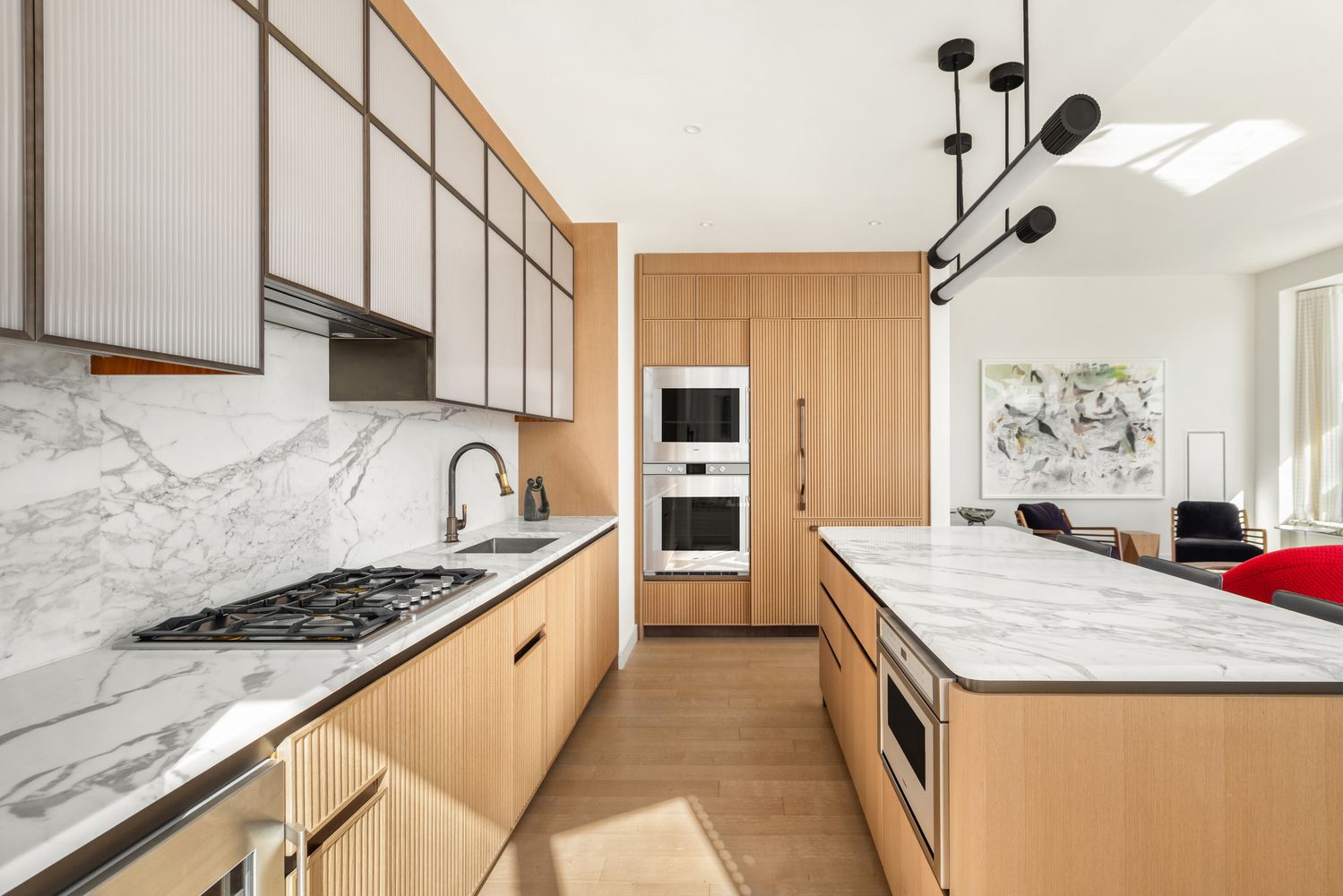 a kitchen with granite countertop a stove a sink dishwasher and a refrigerator