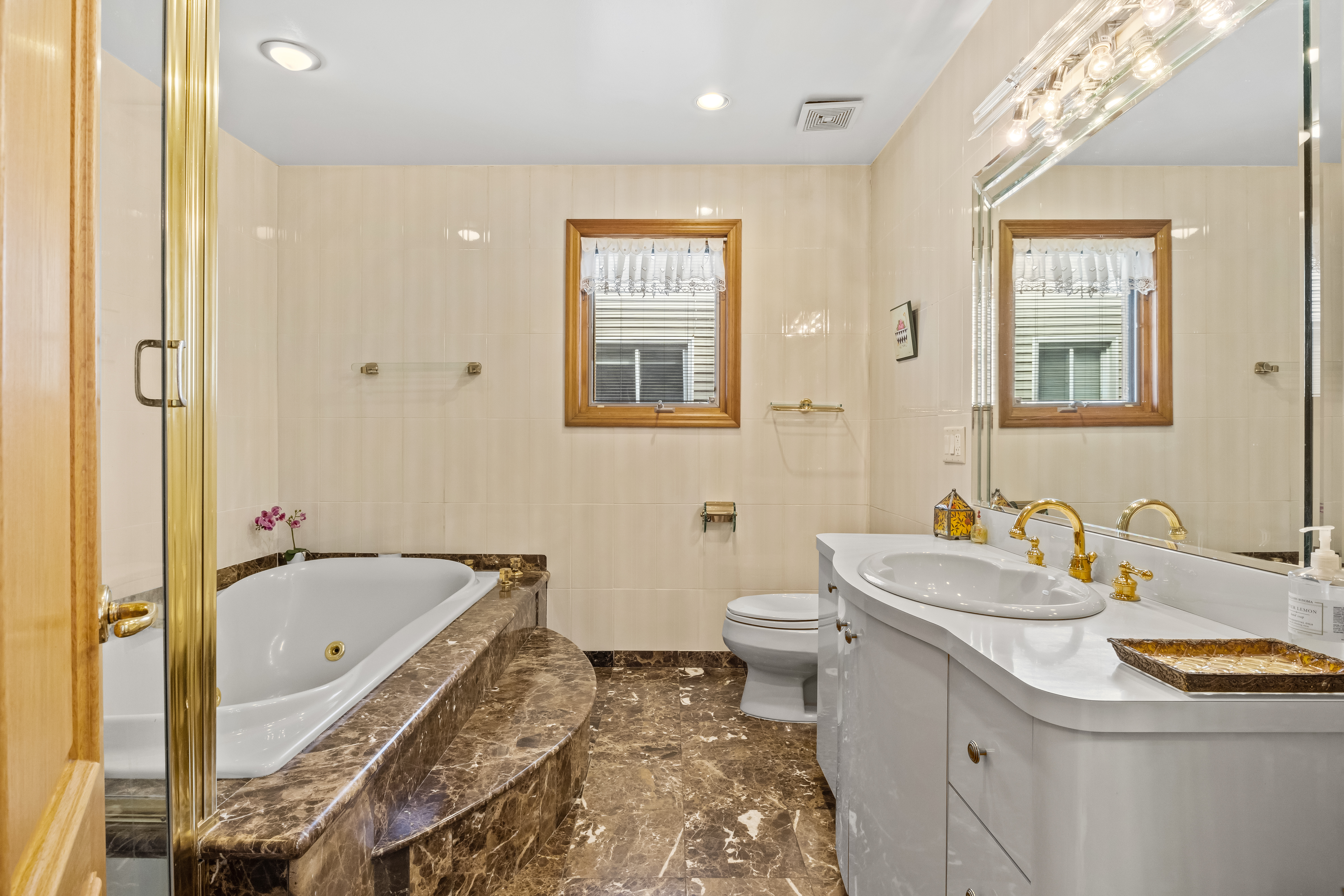 303 Whitman Drive Brooklyn, NY 11234 - Photo 23 of 37 a bathroom with a sink a toilet and shower