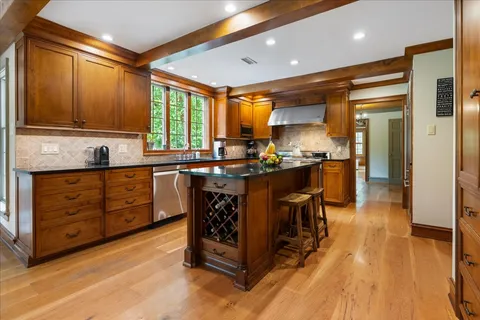a view of a swimming pool with some plants and couches