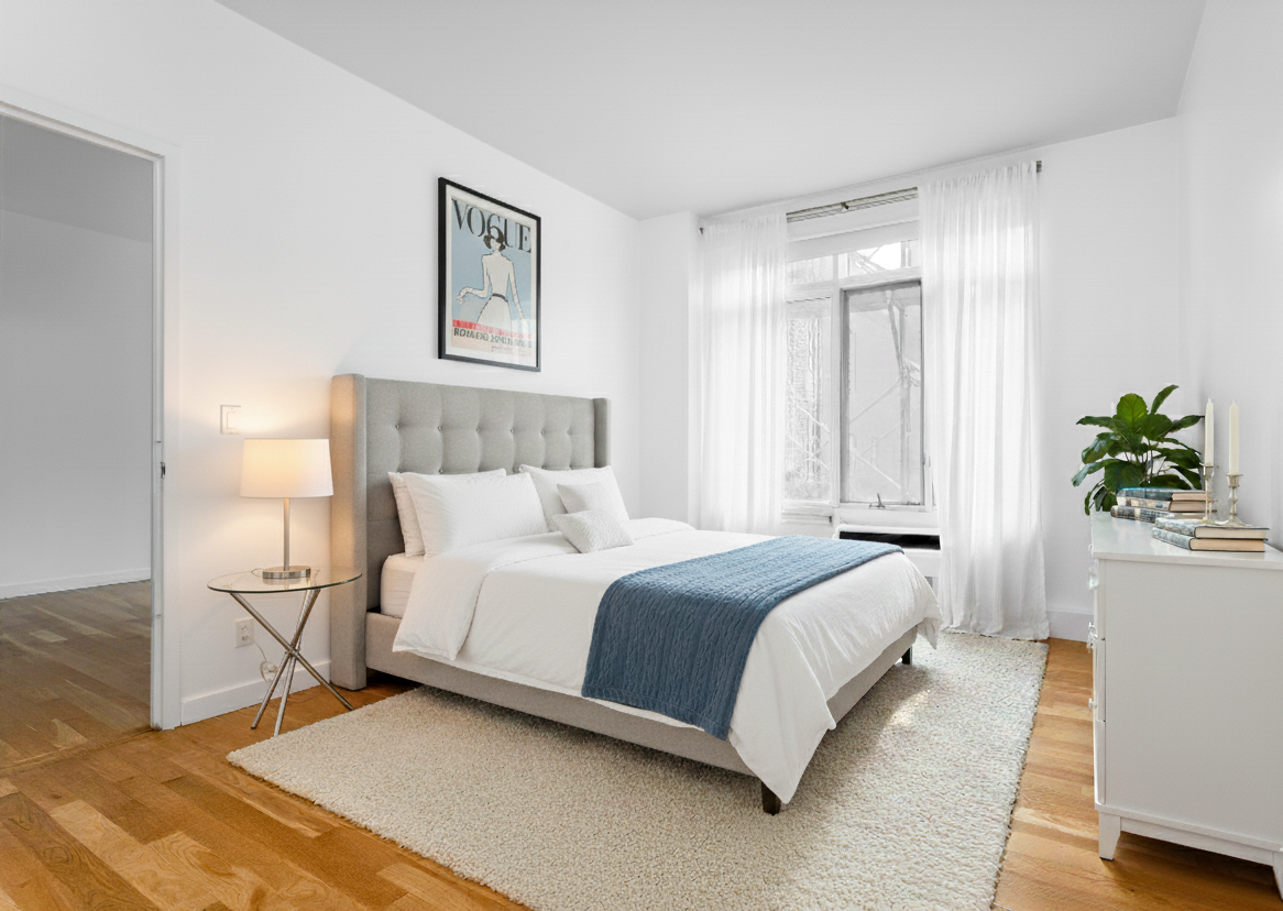 342 East 110th Street, Unit 3D Manhattan, NY 10029 - Photo 9 of 15 a bedroom with a bed and a potted plant