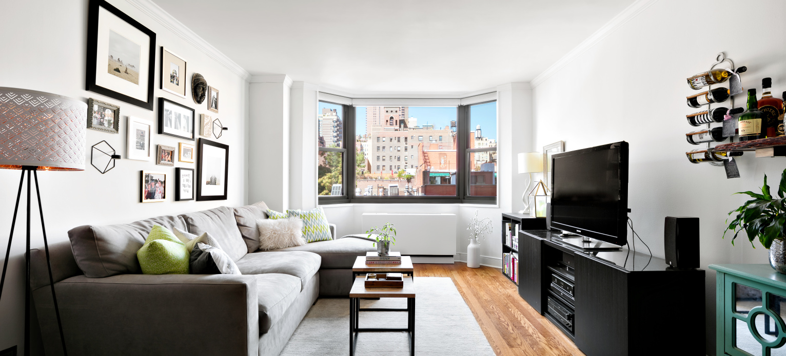 a living room with furniture and a flat screen tv