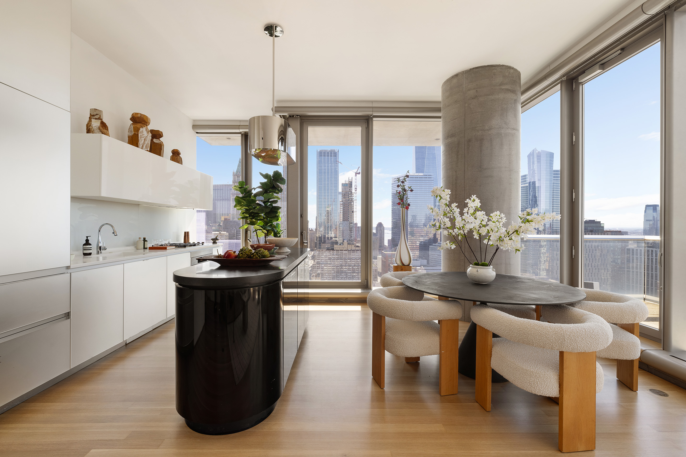 56 Leonard Street, Unit 33AWEST Manhattan, NY 10013 - Photo 2 of 12 a kitchen with a table chairs and entryway