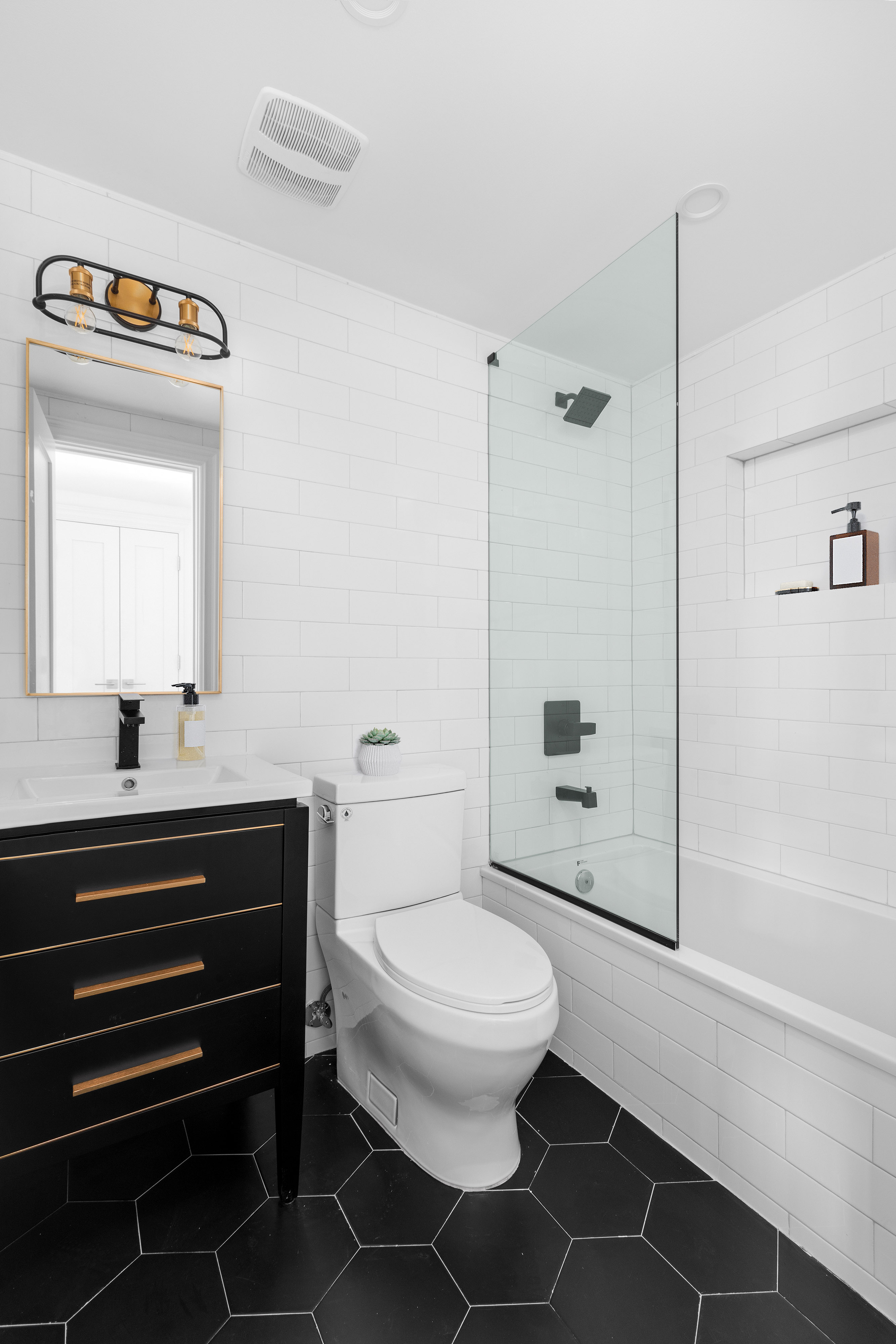 527 Quincy Street, Unit 1 Brooklyn, NY 11221 - Photo 5 of 8 a bathroom with a toilet a sink and shower