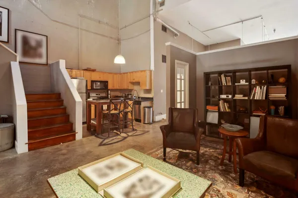 a kitchen with stainless steel appliances a stove a refrigerator and a sink