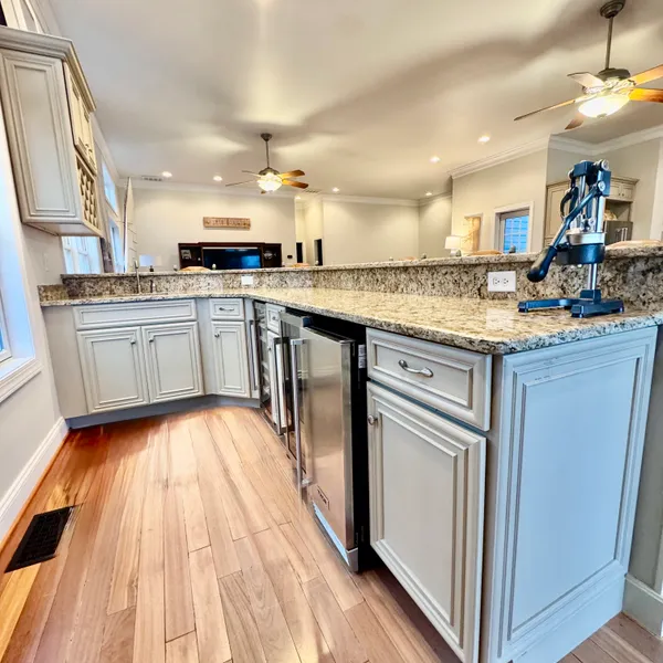 a kitchen with a sink stove and cabinets