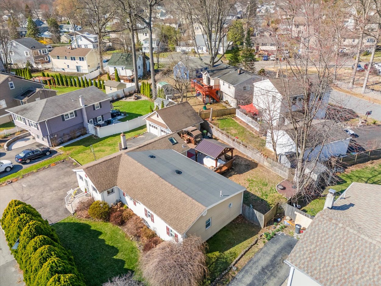 107 Kingston Road Parsippany, NJ 07054 - Photo 39 of 43 an aerial view of a house with a swimming pool patio and outdoor seating