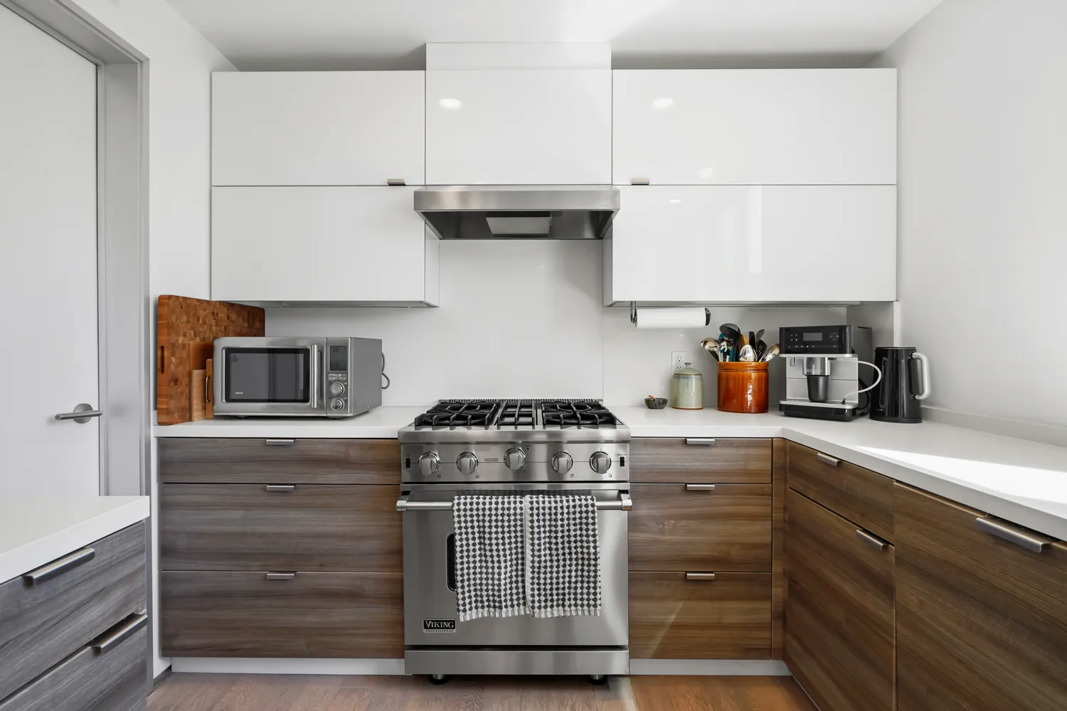 a kitchen with granite countertop a stove and a cabinets