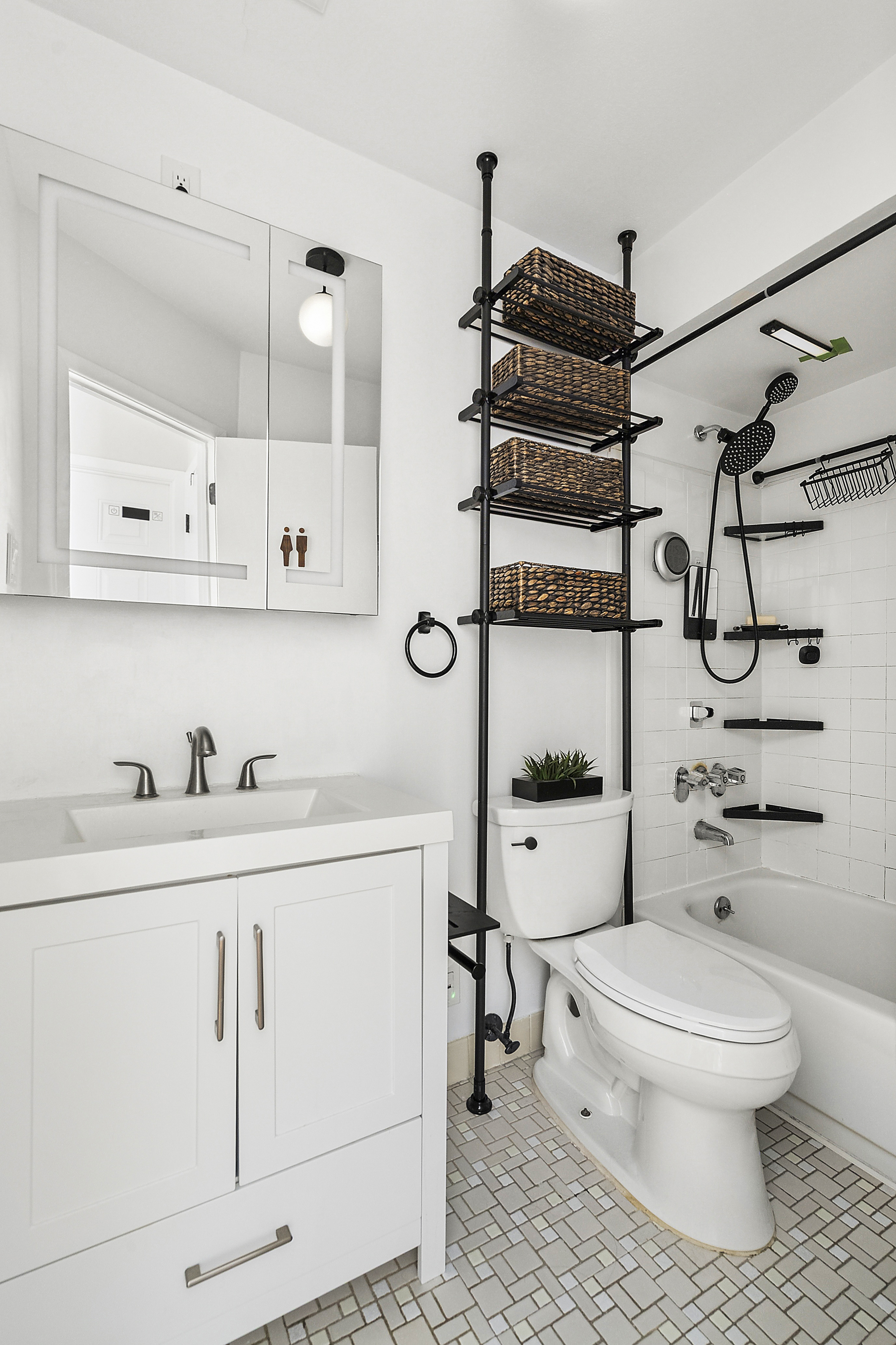 143 Bay Ridge Parkway, Unit 3 Brooklyn, NY 11209 - Photo 7 of 12 a bathroom with a toilet a sink a mirror and shower