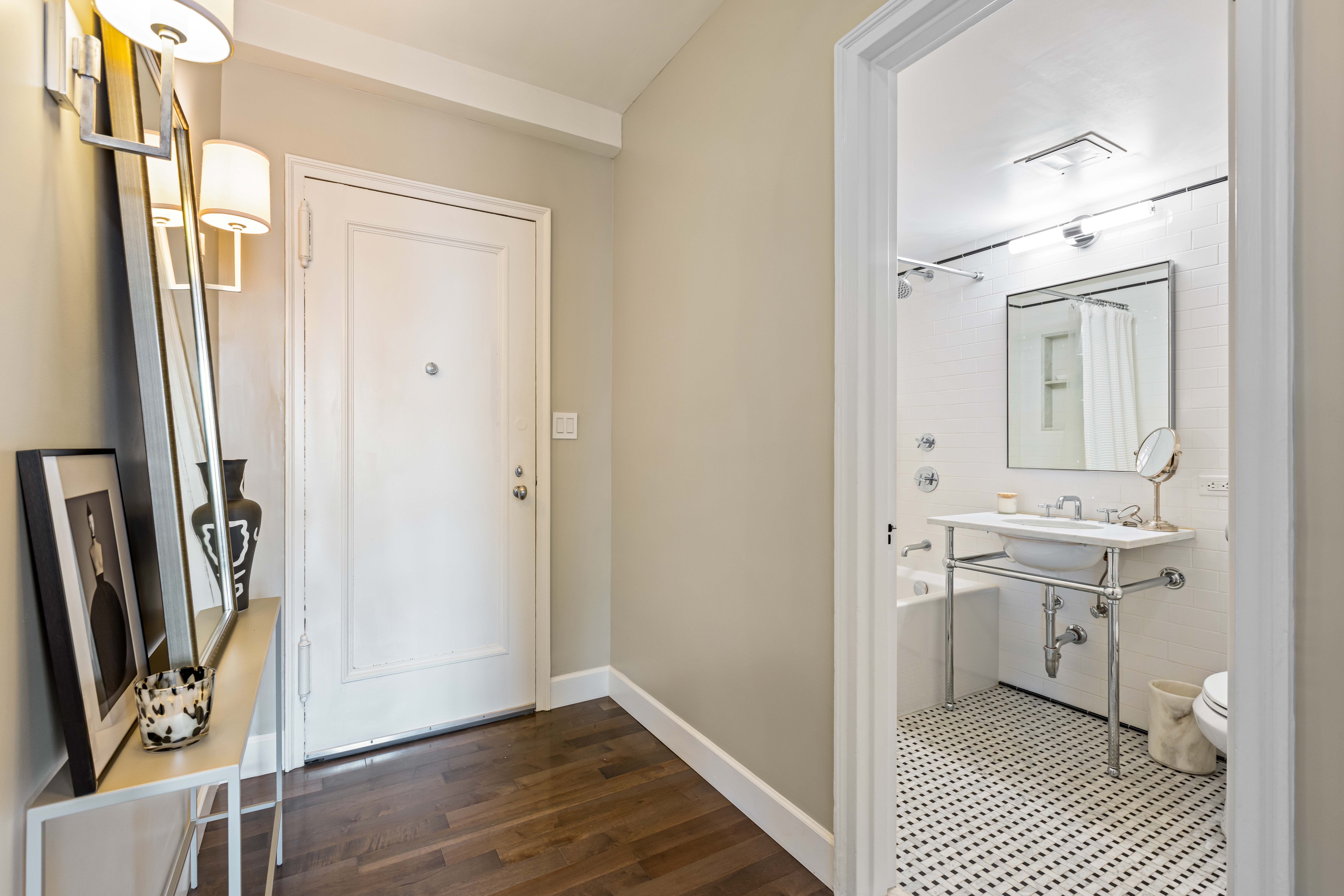 465 West 23rd Street, Unit 15B Manhattan, NY 10011 - Photo 11 of 19 a view of bathroom with a sink mirror and window