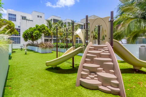 a view of a multi story house with a yard