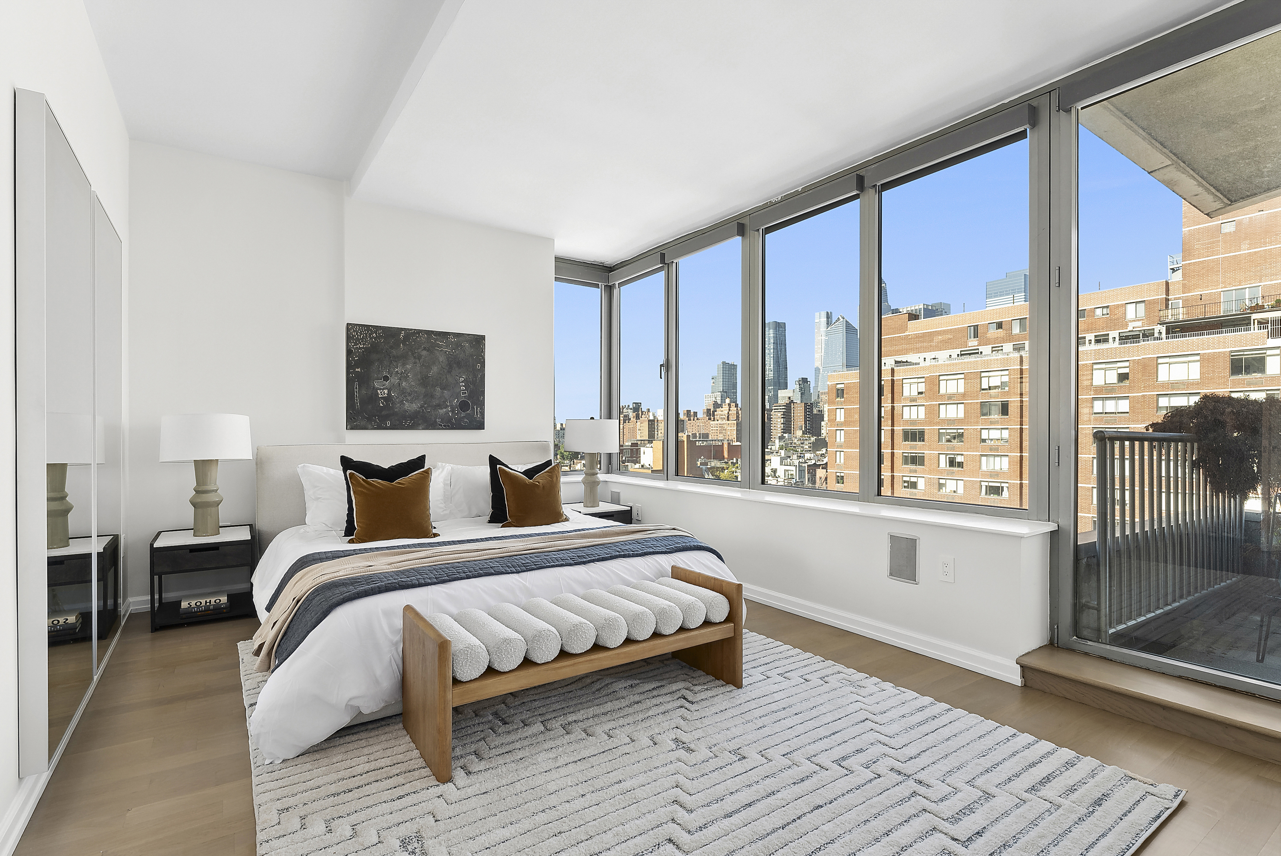 224 West 18th Street, Unit PHA Manhattan, NY 10011 - Photo 10 of 24 a bedroom with a large bed and a large window