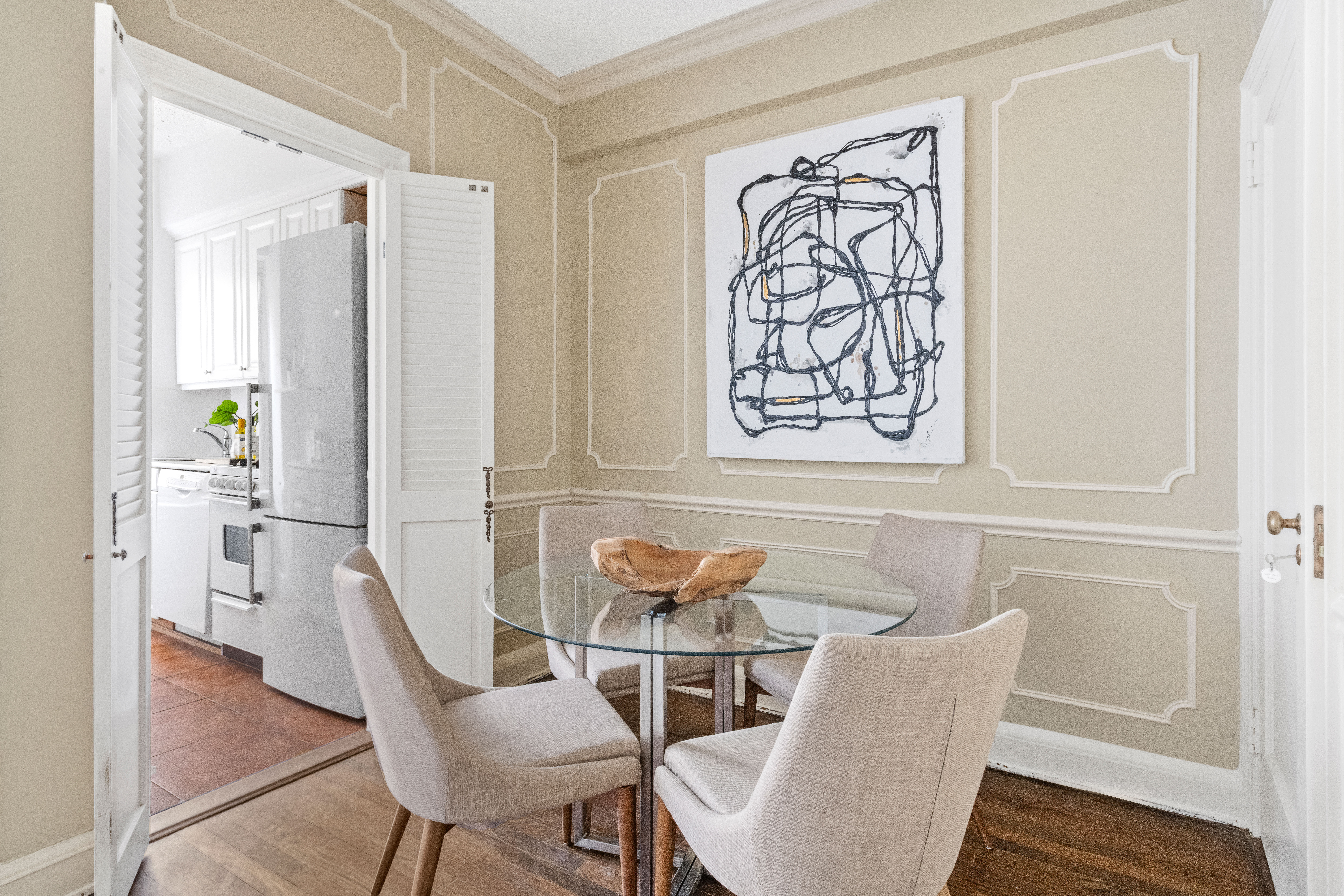 400 East 52nd Street, Unit 6K Manhattan, NY 10022 - Photo 4 of 8 a dining room with furniture and wooden floor