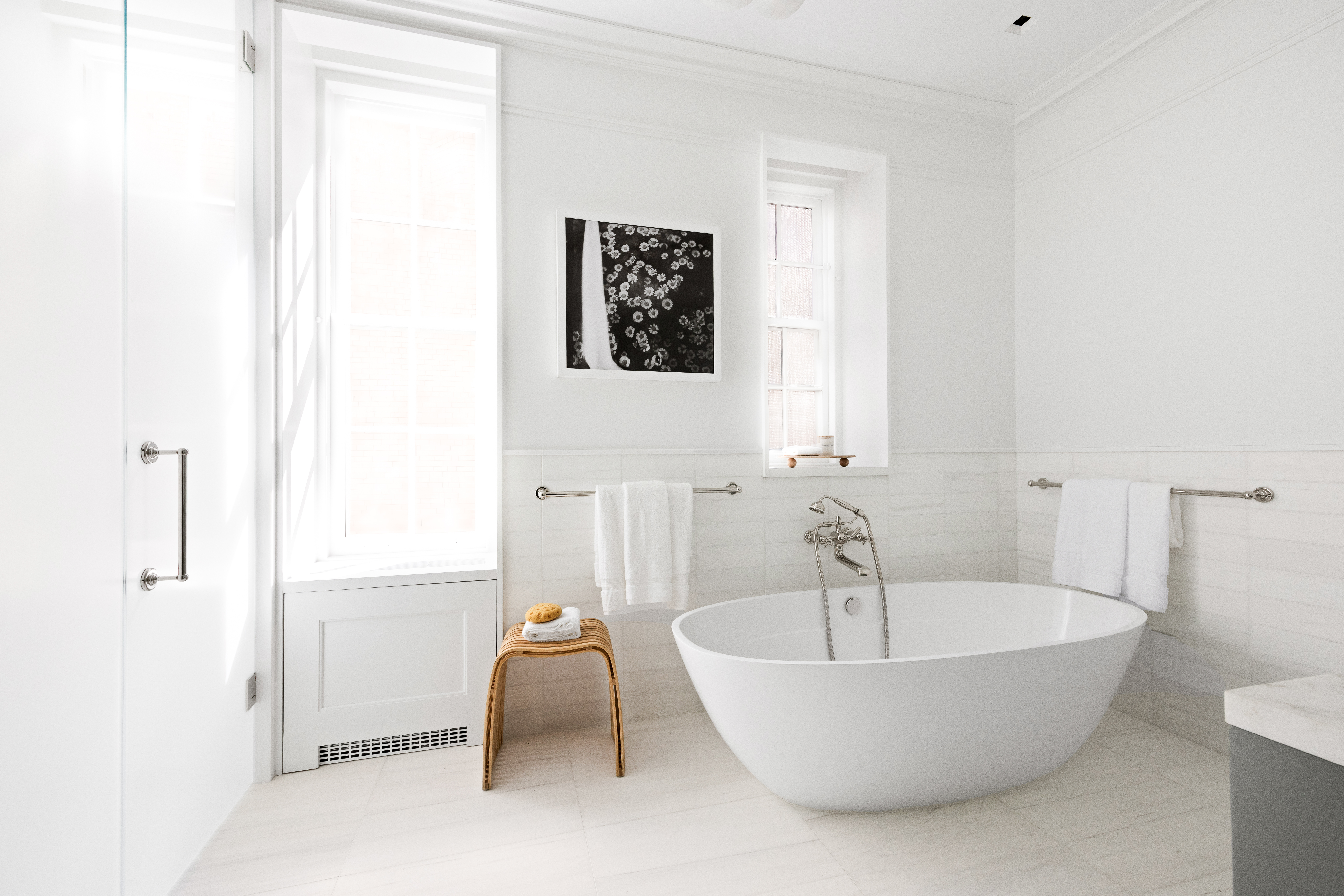 1020 5th Avenue, Unit 9 Manhattan, NY 10028 - Photo 17 of 27 a white bath tub sitting in a bathroom
