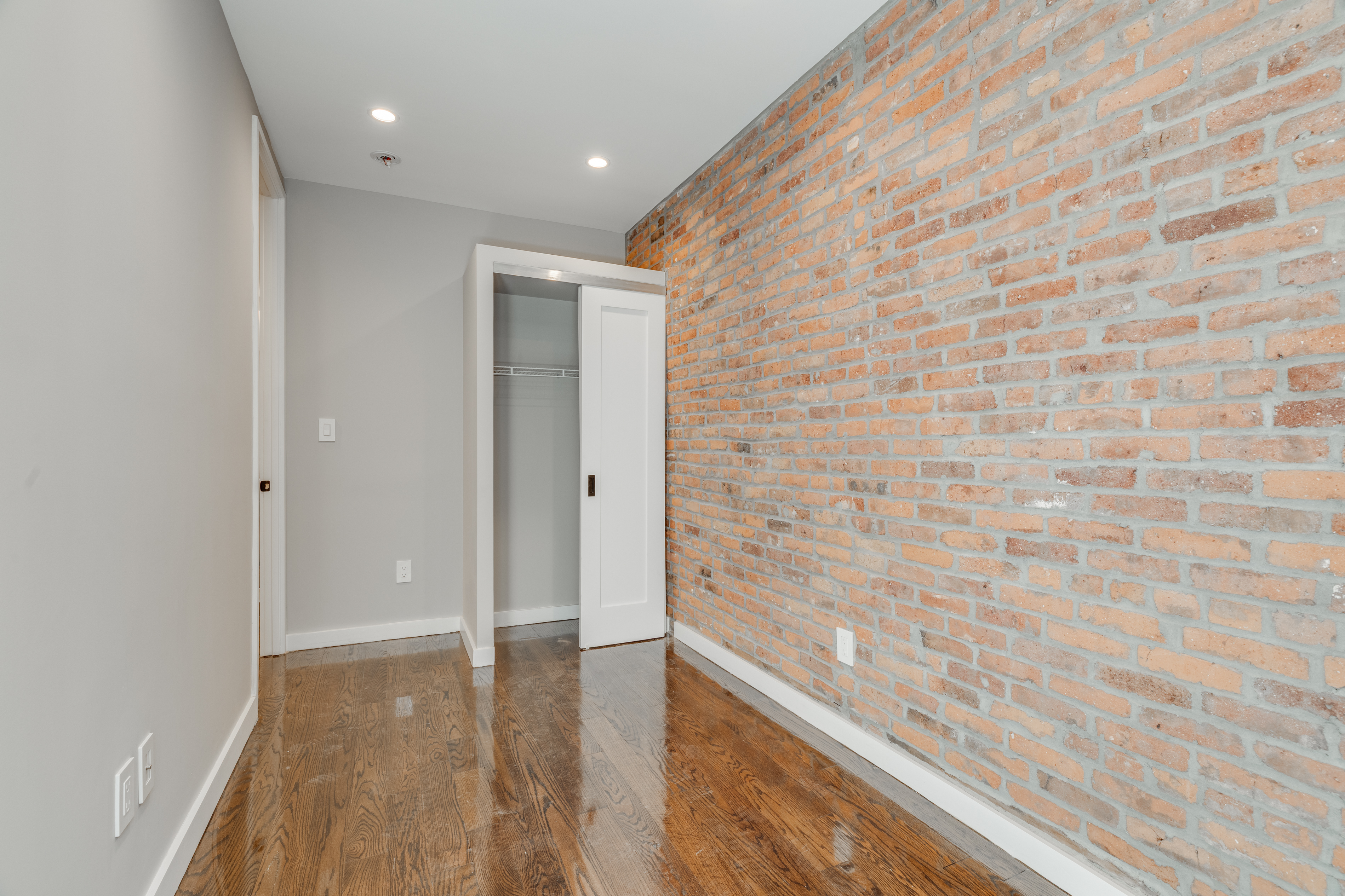 464 West 23rd Street, Unit 1R Manhattan, NY 10011 - Photo 7 of 9 a hallway with a wooden floor