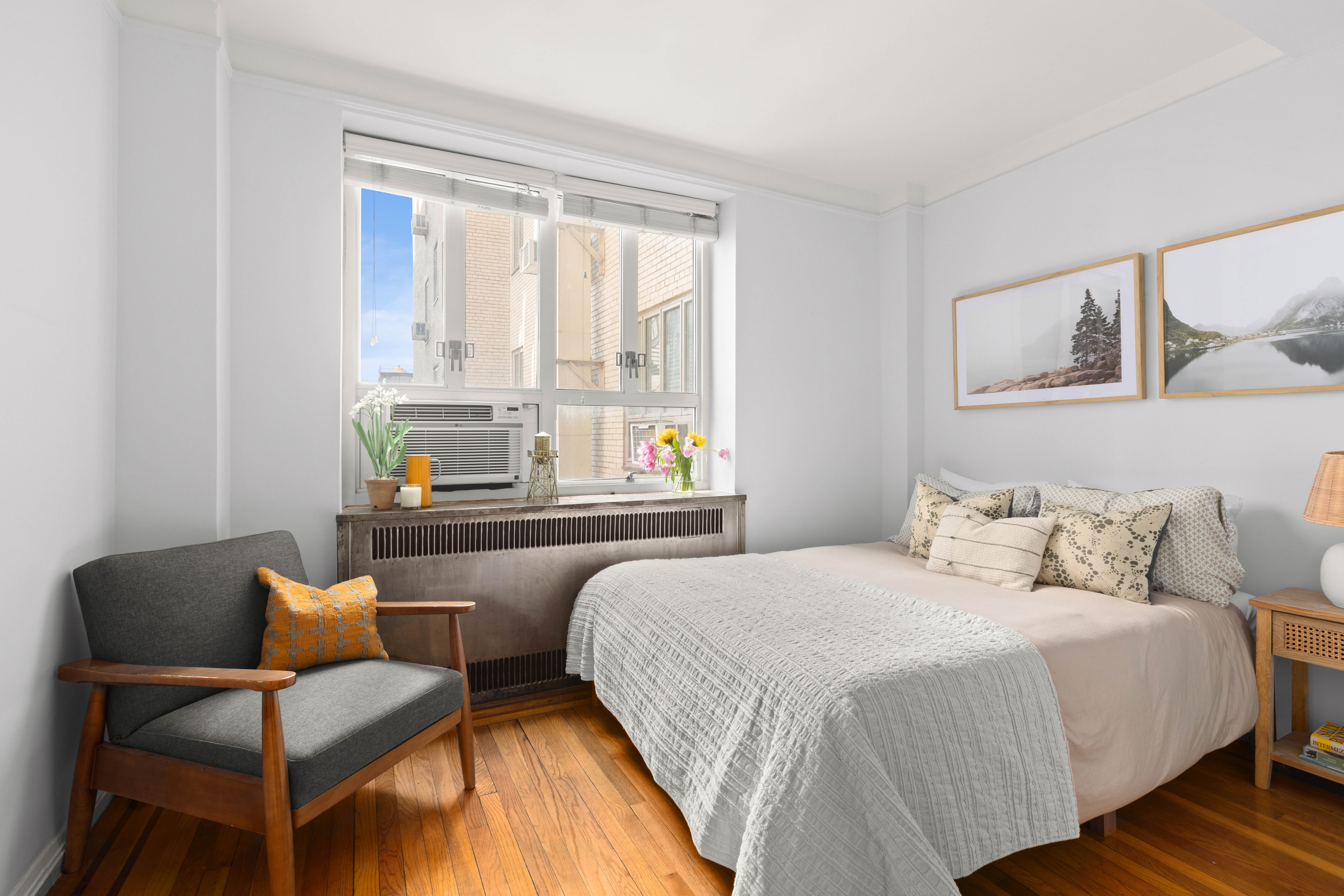 200 West 20th Street, Unit 1002 Manhattan, NY 10011 - Photo 3 of 8 a bedroom with a bed and a couch