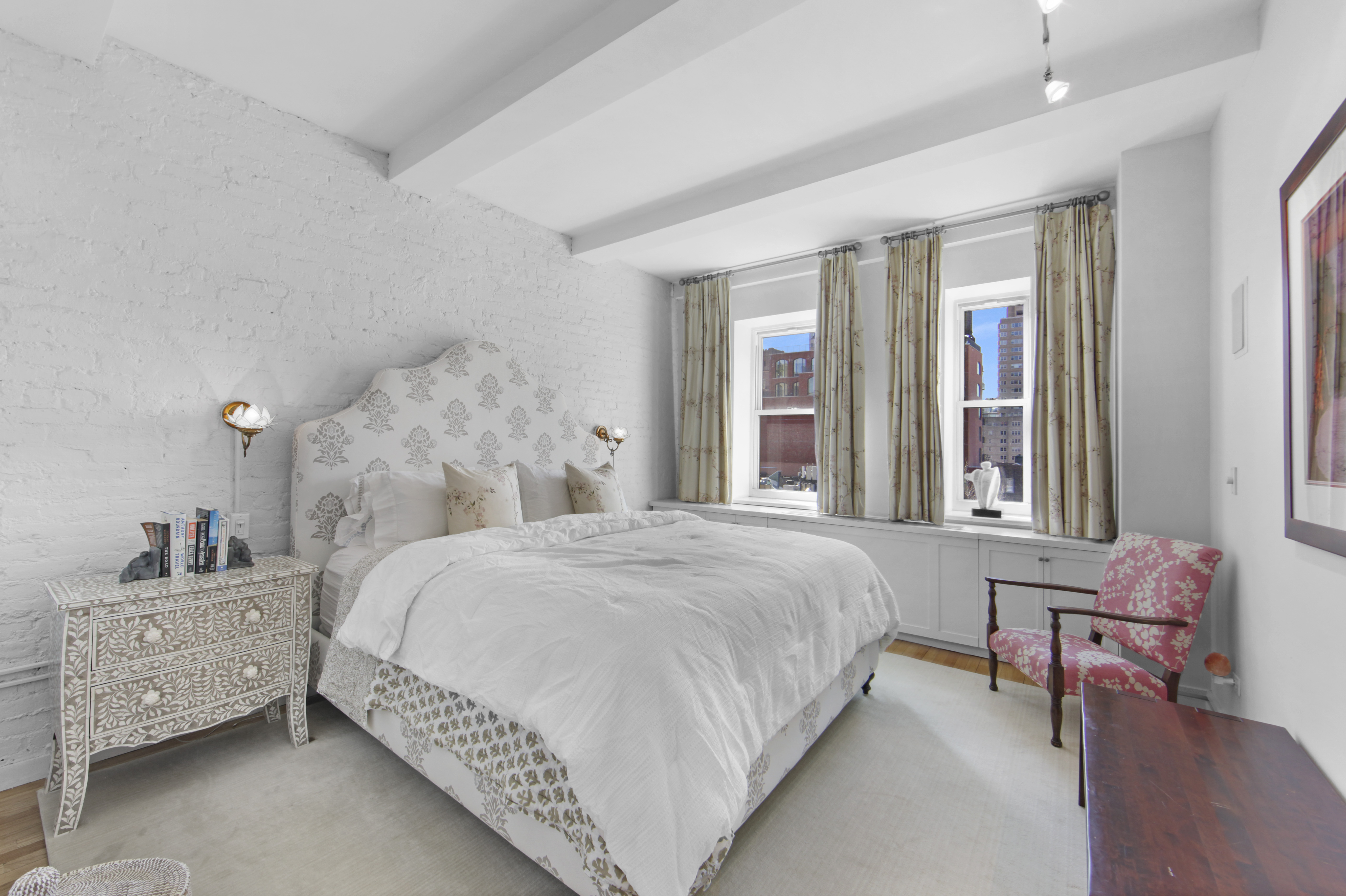 18 East 12th Street, Unit 7BC Manhattan, NY 10003 - Photo 21 of 26 a bedroom with a bed chair and window