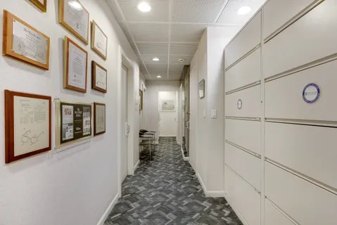 a view of a hallway with a white walls