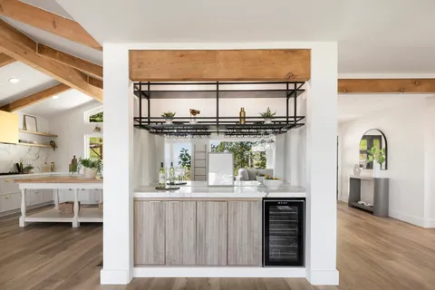 a kitchen with a refrigerator and a sink