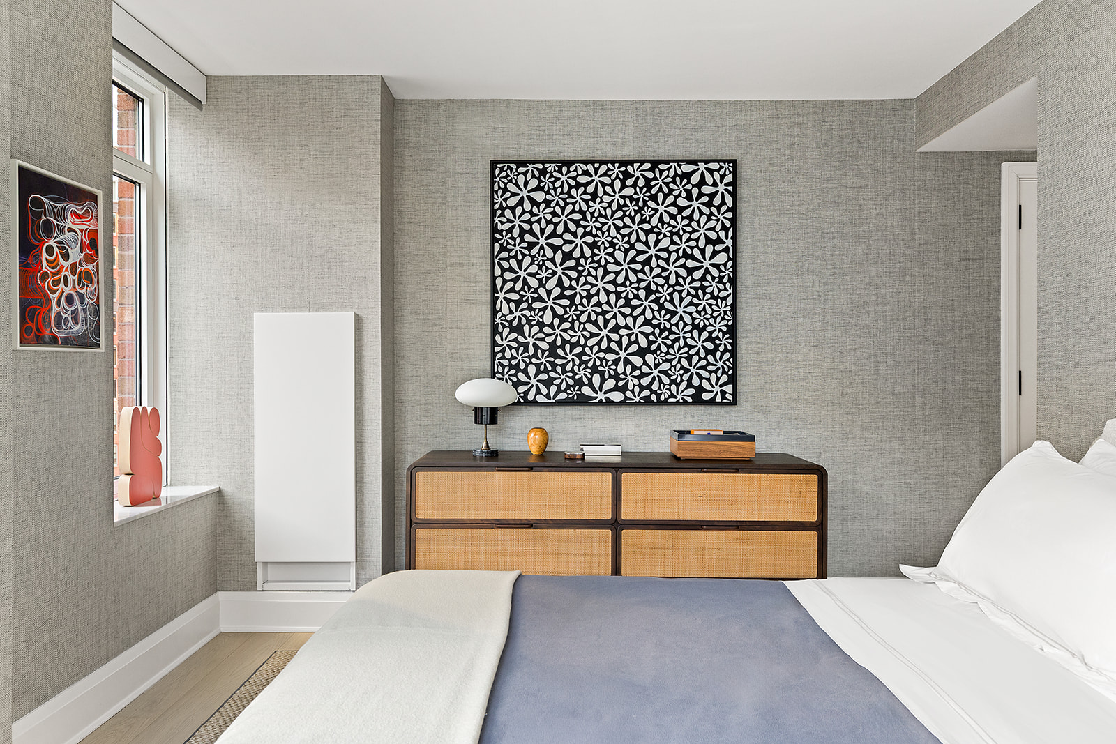 210 Warren Street, Unit 10G Manhattan, NY 10282 - Photo 6 of 15 a bedroom with a bed and white wall