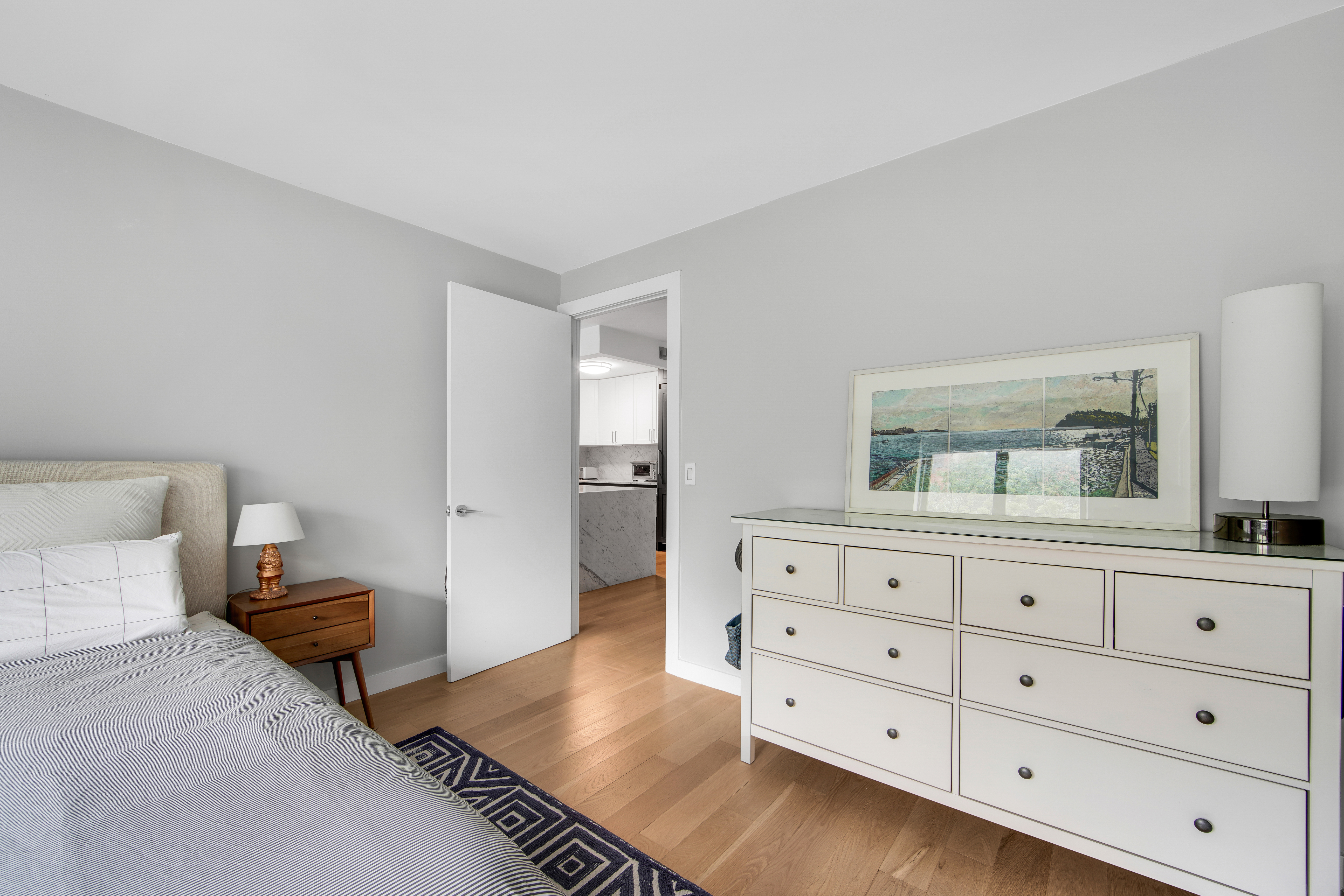 1330 5th Avenue, Unit 3F Manhattan, NY 10026 - Photo 7 of 16 a bedroom with a bed and a dresser